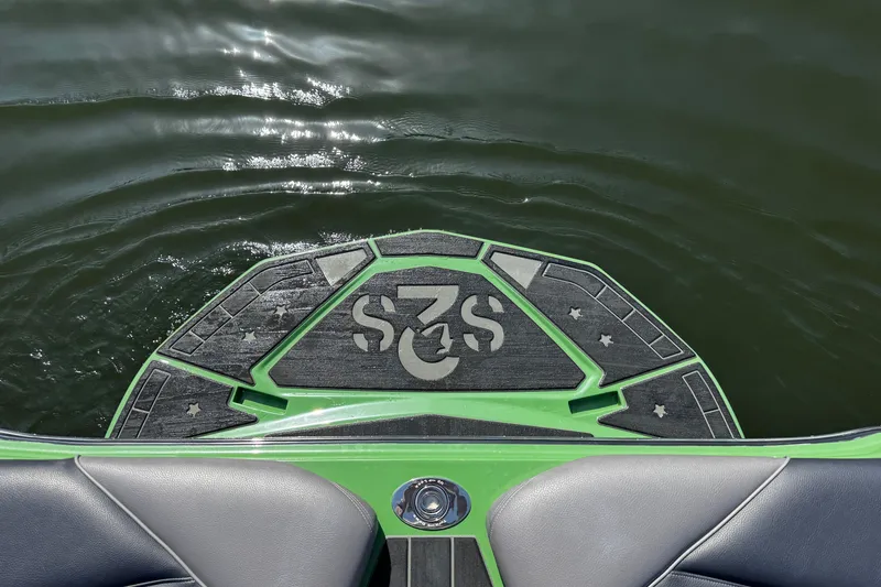 Slide: The Image of Green Centurion Nv243 boat platform on water, featuring star patterns, 2026 model. - 16