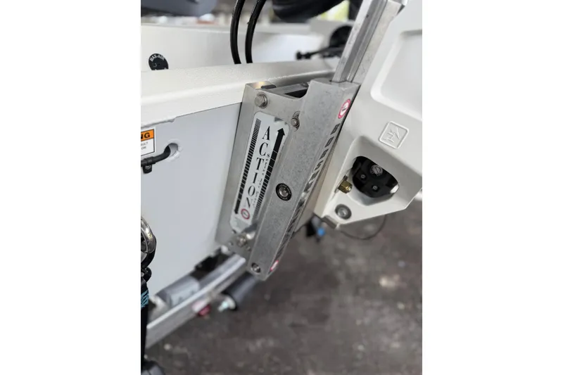 Slide: The Image of Close-up of Avid 21 Mag 2027 boat component with "Action" label and metallic finish. - 16