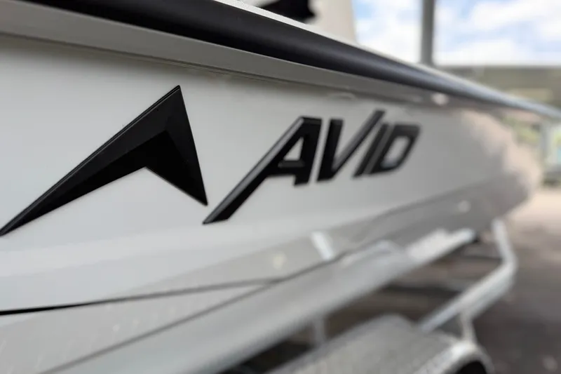 Slide: The Image of Close-up of 2027 Avid 21 Mag boat logo on white hull. - 13