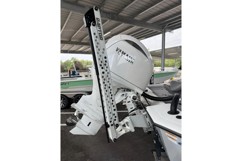 Slide: The Image of Avid 21 Mag 2027 boat with Yamaha outboard motor and Raptor anchor system. - 14