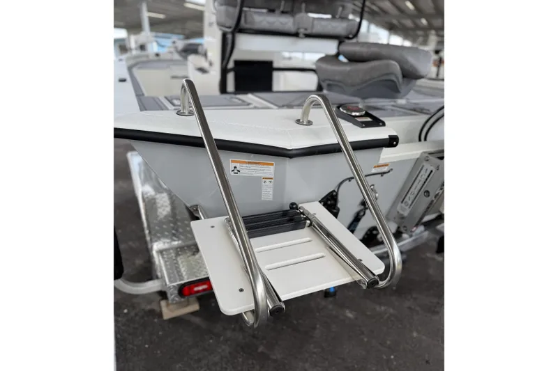 Slide: The Image of Avid 21 Mag 2027 boat with stainless steel swim ladder and seating area. - 17
