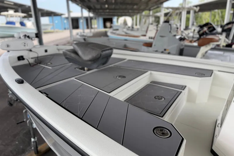 Slide: The Image of Avid 21 Mag 2027 boat interior with sleek seating and storage compartments. - 23