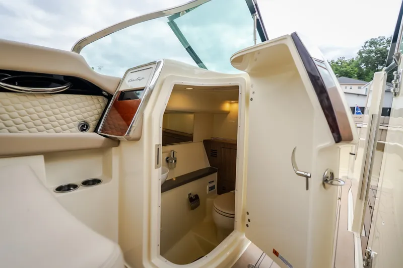 Slide: The Image of 2027 Chris-Craft Launch 35 GT boat interior with open cabin door, showcasing luxury design. - 64
