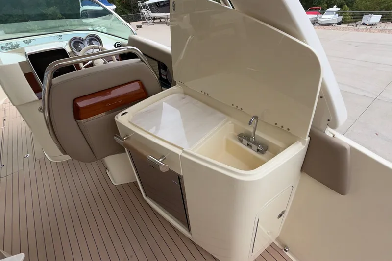 Slide: The Image of 2027 Chris-Craft Launch 35 GT boat interior with sink and steering wheel. - 34