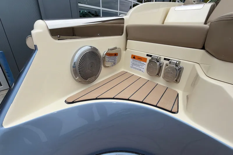 Slide: The Image of 2027 Chris-Craft Launch 35 GT boat interior, featuring speaker and utility ports. - 10