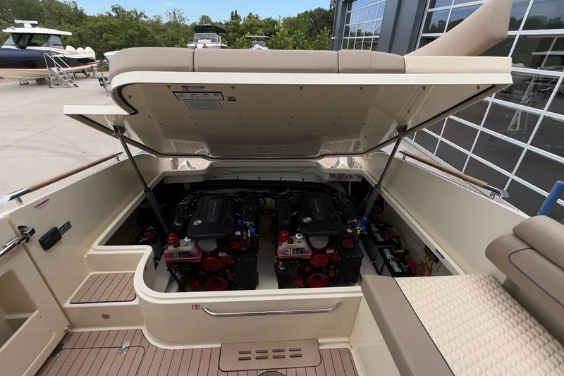 Slide: The Image of 2027 Chris-Craft Launch 35 GT engine compartment, showcasing dual engines and spacious layout. - 65