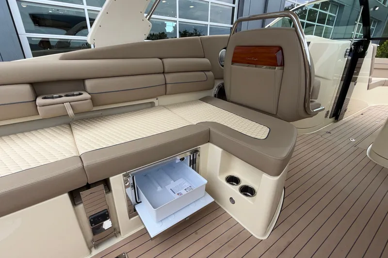 Slide: The Image of Luxurious interior of 2027 Chris-Craft Launch 35 GT with beige seating and built-in cooler. - 37
