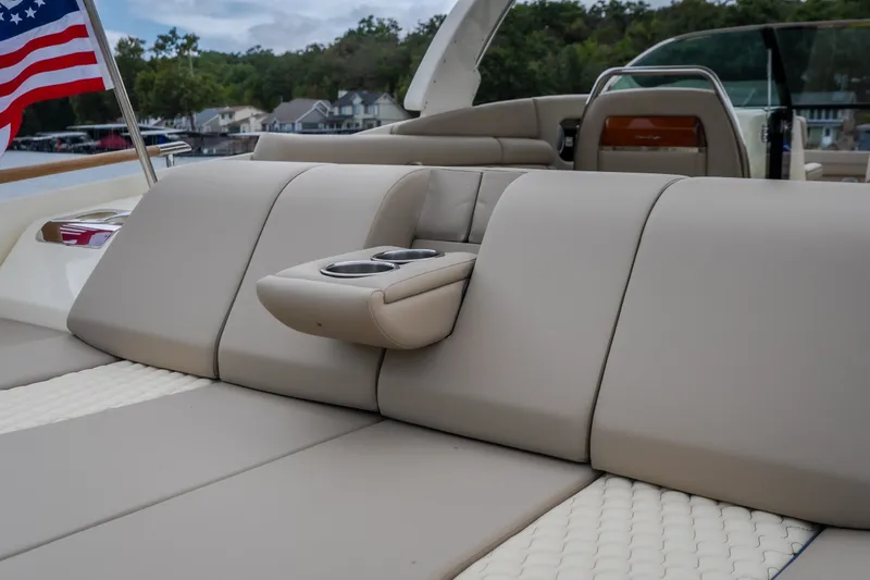 Slide: The Image of 2027 Chris-Craft Launch 35 GT boat interior with beige seating and cup holders. - 19