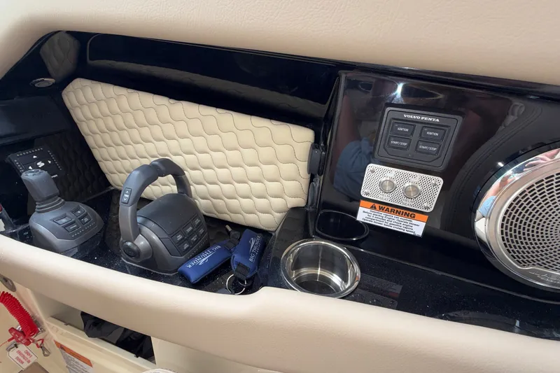 Slide: The Image of Dashboard of 2027 Chris-Craft Launch 35 GT with controls and speaker system. - 63
