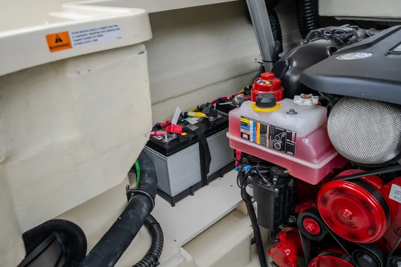Slide: The Image of Engine compartment of 2027 Chris-Craft Launch 35 GT, featuring battery and coolant system. - 34