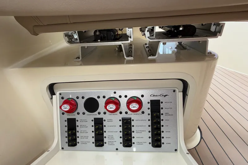 Slide: The Image of Control panel of 2027 Chris-Craft Launch 35 GT boat, featuring switches and dials. - 58