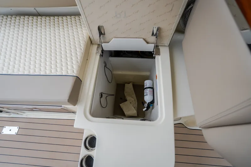 Slide: The Image of Storage compartment on 2027 Chris-Craft Launch 35 GT boat with fire extinguisher. - 82