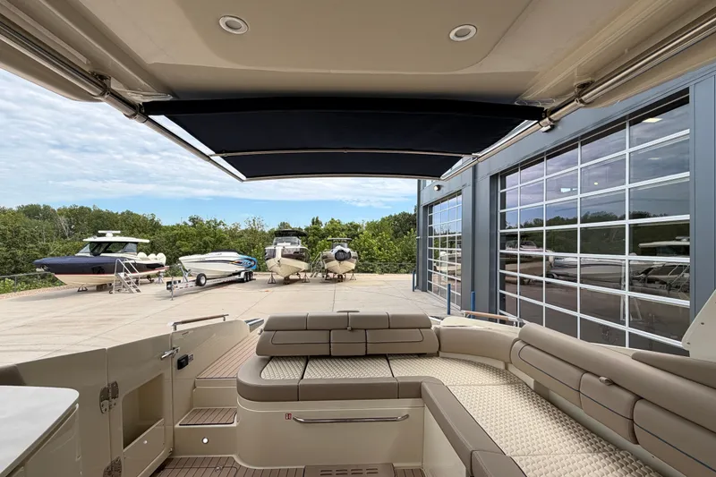Slide: The Image of 2027 Chris-Craft Launch 35 GT interior, showcasing luxury seating and modern design at a marina. - 75