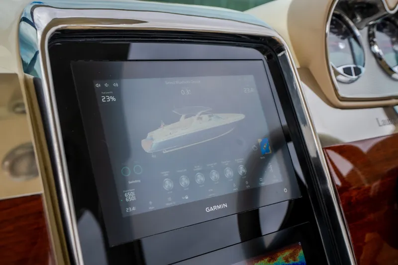 Slide: The Image of Touchscreen display on 2027 Chris-Craft Launch 35 GT boat dashboard, featuring Garmin interface. - 53