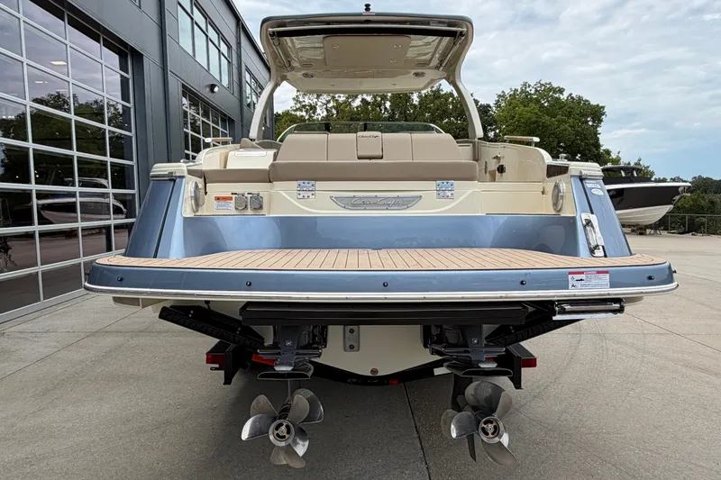 Slide: The Image of 2027 Chris-Craft Launch 35 GT boat, rear view, docked outdoors. - 7