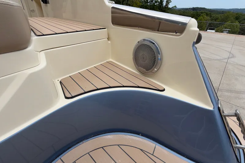 Slide: The Image of 2027 Chris-Craft Launch 35 GT boat interior with teak flooring and speaker detail. - 11