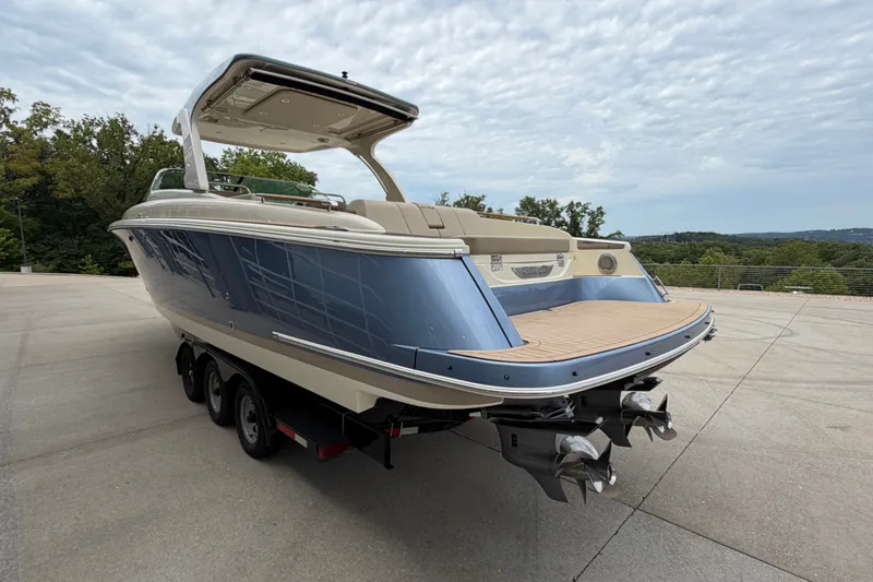Slide: The Image of 2027 Chris-Craft Launch 35 GT boat on trailer, showcasing sleek design and modern features. - 2