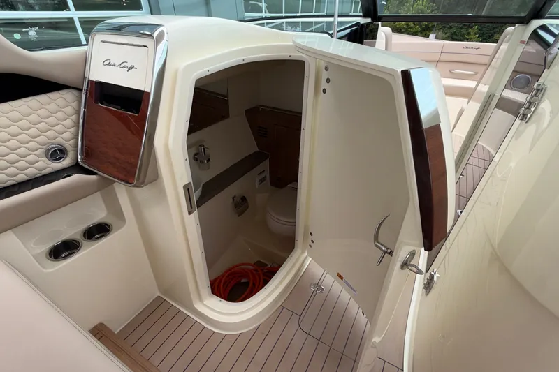 Slide: The Image of 2027 Chris-Craft Launch 35 GT interior cabin with open door, showcasing luxury design. - 43
