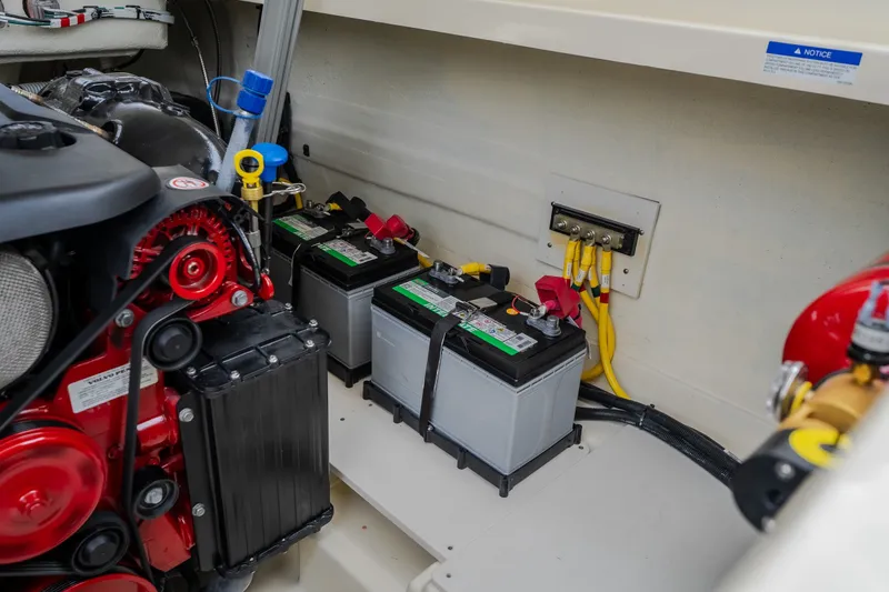 Slide: The Image of Engine compartment of 2027 Chris-Craft Launch 35 GT with batteries and wiring. - 33
