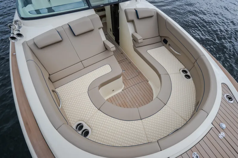 Slide: The Image of Luxurious seating area on 2027 Chris-Craft Launch 35 GT boat, featuring elegant upholstery. - 79