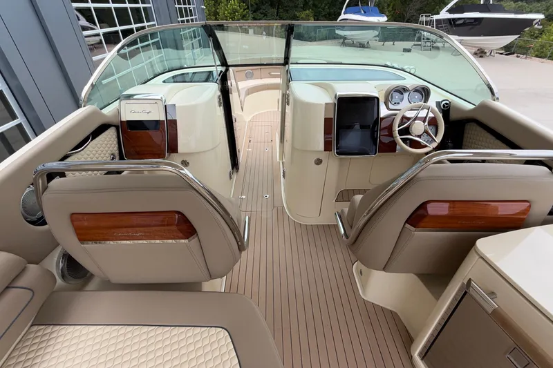 Slide: The Image of 2027 Chris-Craft Launch 35 GT boat interior with luxurious seating and modern dashboard. - 32