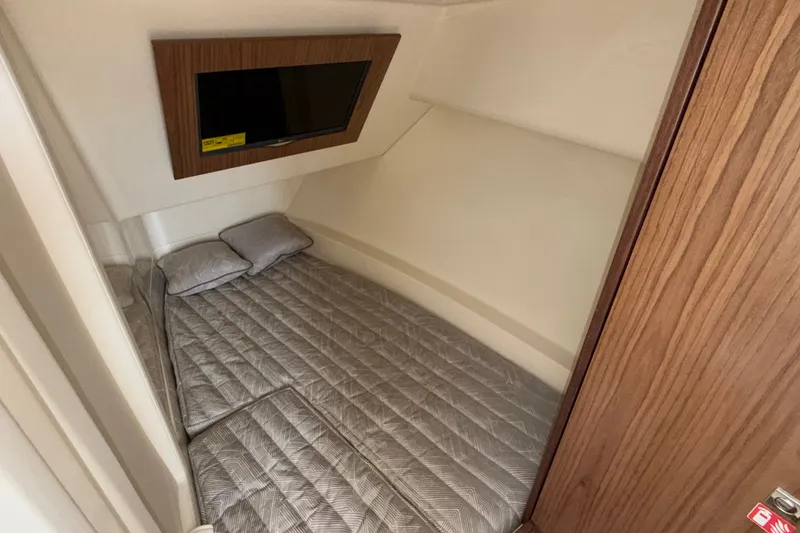 Slide: The Image of Cozy cabin interior of 2027 Chris-Craft Launch 35 GT with bed and TV. - 47