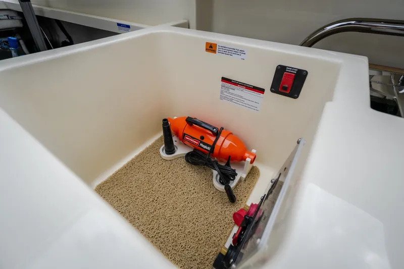 Slide: The Image of Storage compartment in 2027 Chris-Craft Launch 35 GT boat with safety equipment. - 36