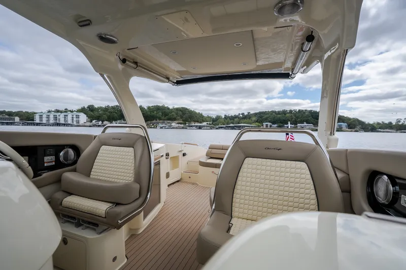 Slide: The Image of Luxurious interior of 2027 Chris-Craft Launch 35 GT boat with elegant seating and scenic water view. - 80