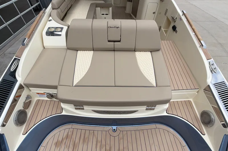 Slide: The Image of 2027 Chris-Craft Launch 35 GT boat interior with beige seating and wood accents. - 12