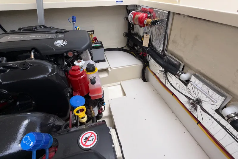 Slide: The Image of Engine compartment of 2027 Chris-Craft Launch 35 GT, showcasing modern components and fire safety equipment. - 73