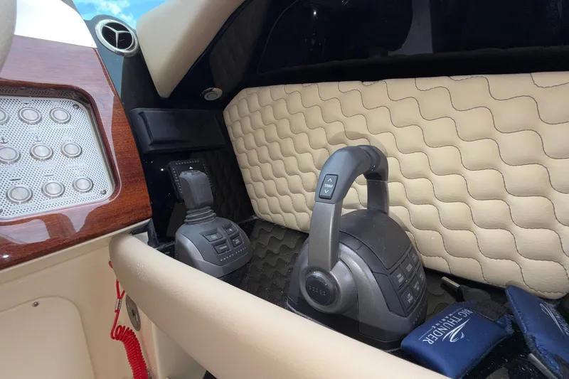 Slide: The Image of 2027 Chris-Craft Launch 35 GT cockpit with luxurious controls and quilted leather detailing. - 62