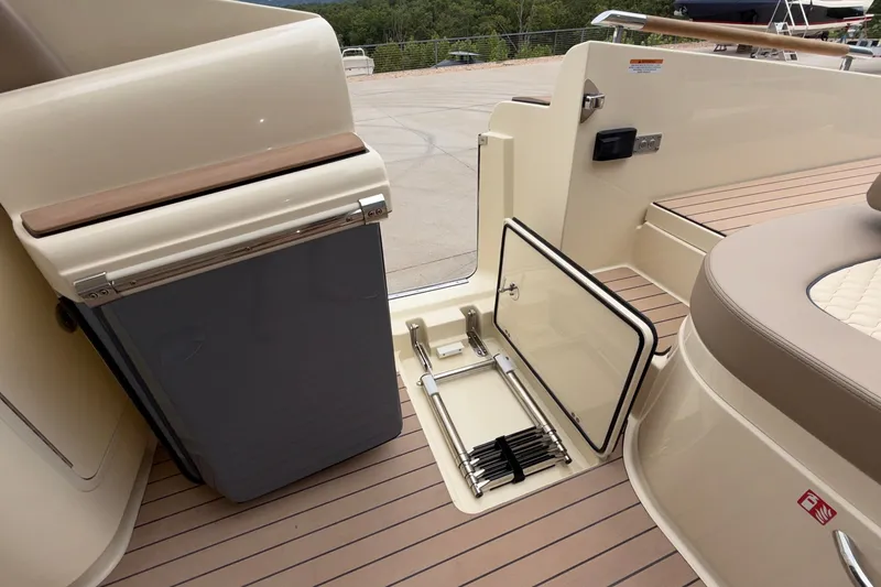 Slide: The Image of 2027 Chris-Craft Launch 35 GT boat interior with storage compartment and seating area. - 26