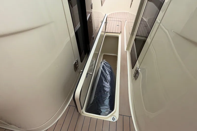 Slide: The Image of Storage compartment on 2027 Chris-Craft Launch 35 GT boat, featuring sleek design and ample space. - 57