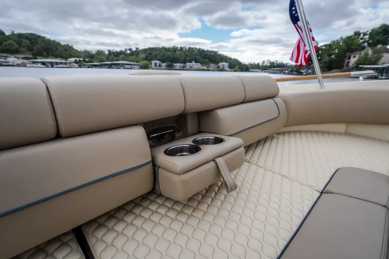 Slide: The Image of Luxurious seating on 2027 Chris-Craft Launch 35 GT boat with cup holders and American flag. - 26