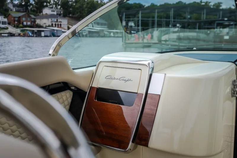 Slide: The Image of 2027 Chris-Craft Launch 35 GT dashboard with elegant wood and chrome accents. - 63
