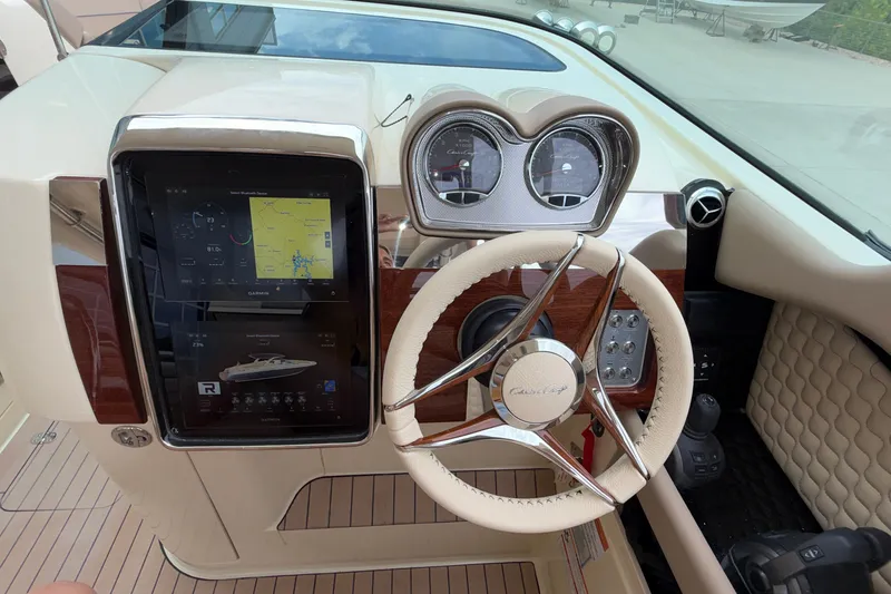 Slide: The Image of Dashboard of 2027 Chris-Craft Launch 35 GT with modern navigation display and steering wheel. - 61