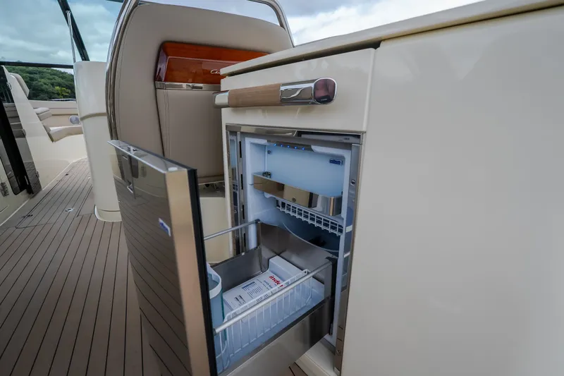 Slide: The Image of 2027 Chris-Craft Launch 35 GT boat interior with open mini fridge. - 46