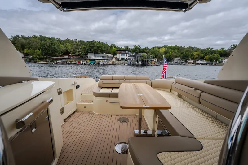 Slide: The Image of Luxurious 2027 Chris-Craft Launch 35 GT boat interior with elegant seating and lake view. - 43