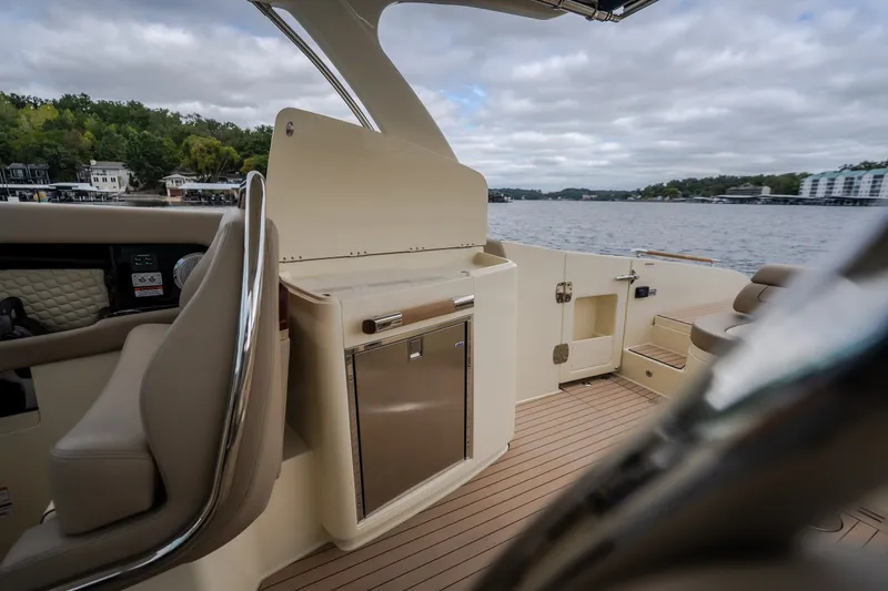 Slide: The Image of Luxurious 2027 Chris-Craft Launch 35 GT boat interior with elegant seating and scenic lake view. - 45