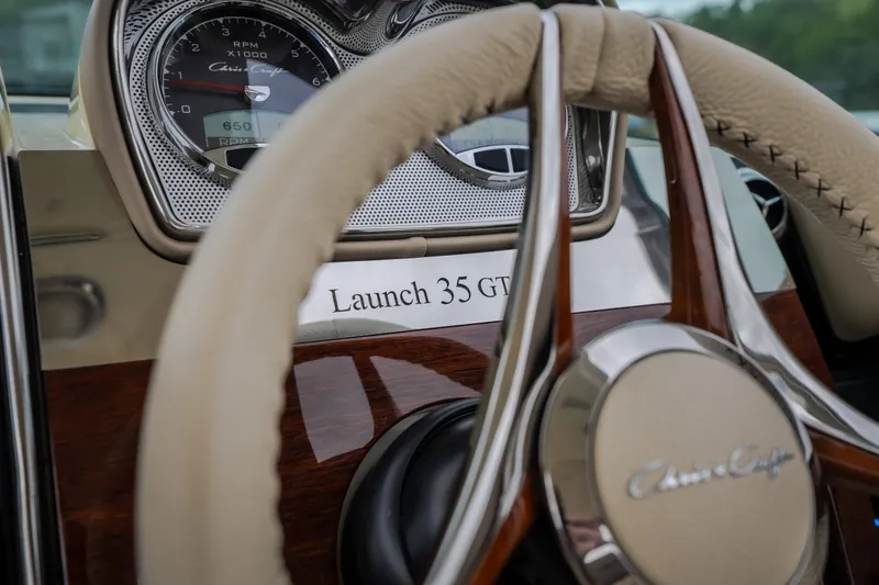 Slide: The Image of Steering wheel and dashboard of 2027 Chris-Craft Launch 35 GT boat. - 54