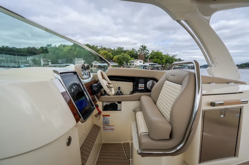 Slide: The Image of 2027 Chris-Craft Launch 35 GT boat interior with luxurious seating and modern dashboard. - 52