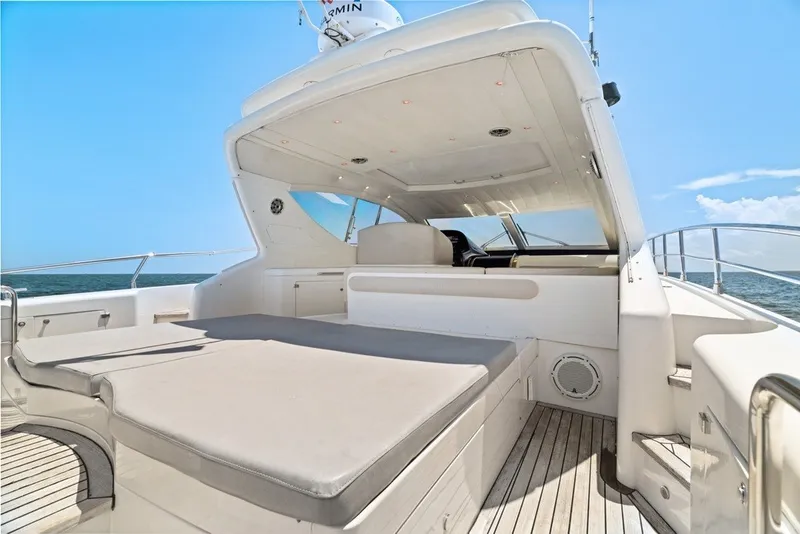 Slide: The Image of Luxury Uniesse 54 Sport yacht deck, 2005 model, with spacious seating and ocean view. - 26