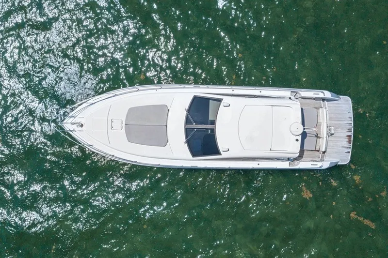 Slide: The Image of Aerial view of 2005 Uniesse 54 Sport yacht on clear green water. - 5