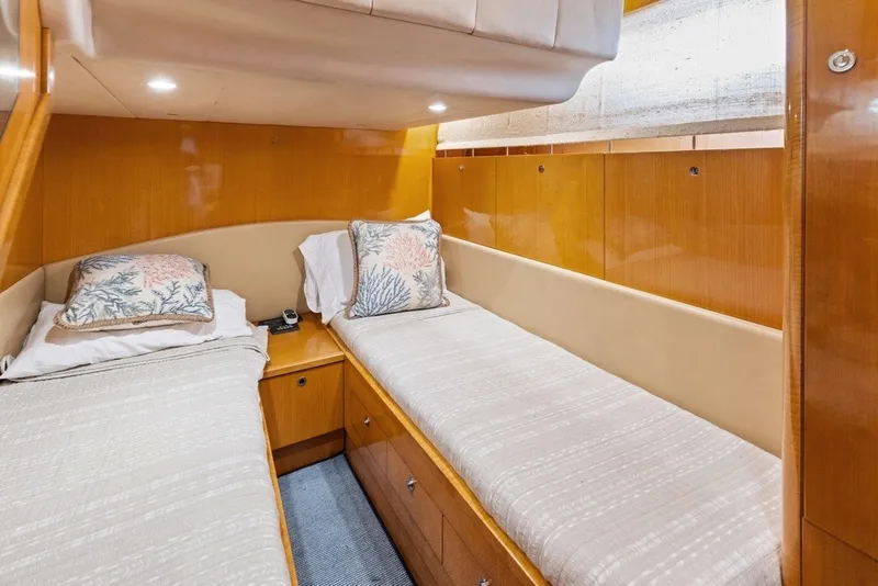 Slide: The Image of Luxurious twin cabin in 2005 Uniesse 54 Sport yacht with wood paneling and cozy bedding. - 15