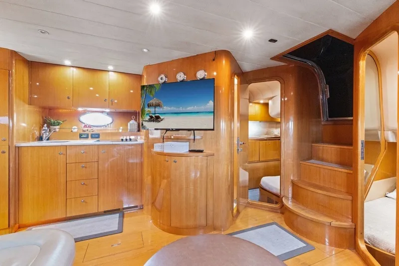Slide: The Image of Luxurious interior of 2005 Uniesse 54 Sport yacht with wooden cabinetry and modern amenities. - 9