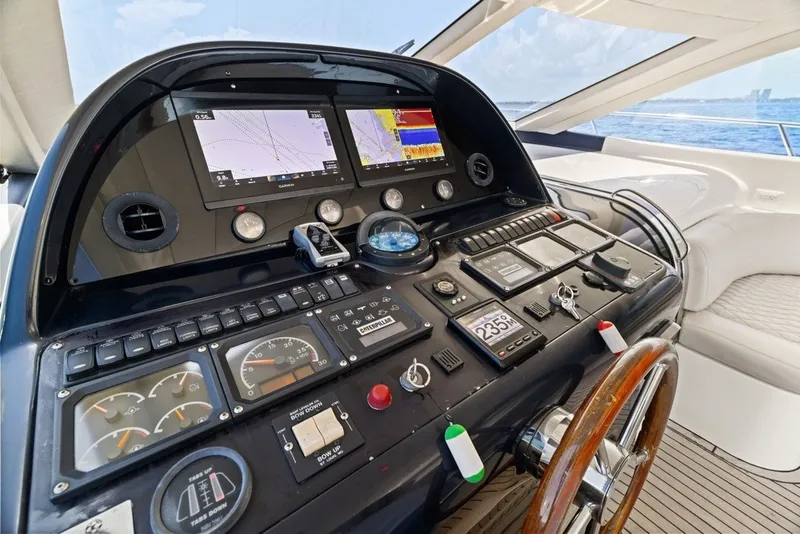 Slide: The Image of Control panel of a 2005 Uniesse 54 Sport yacht with navigation displays. - 8