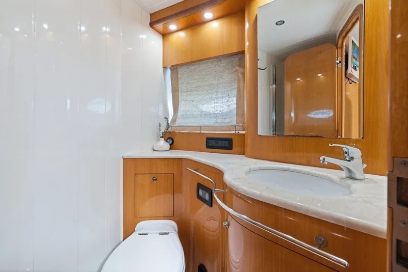 Slide: The Image of Luxurious bathroom in 2005 Uniesse 54 Sport yacht with wooden cabinetry and modern fixtures. - 17