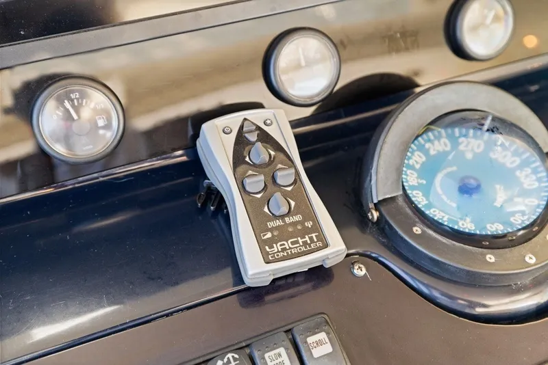 Slide: The Image of Yacht controller on Uniesse 54 Sport dashboard, 2005 model, with gauges and compass. - 20