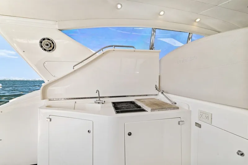 Slide: The Image of Luxurious 2005 Uniesse 54 Sport yacht interior with sleek kitchenette and ocean view. - 21