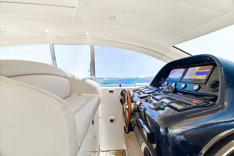 Slide: The Image of Luxurious helm of 2005 Uniesse 54 Sport yacht with modern navigation equipment. - 7